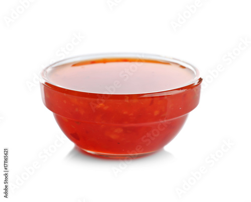 Tasty chili sauce in bowl, isolated on white
