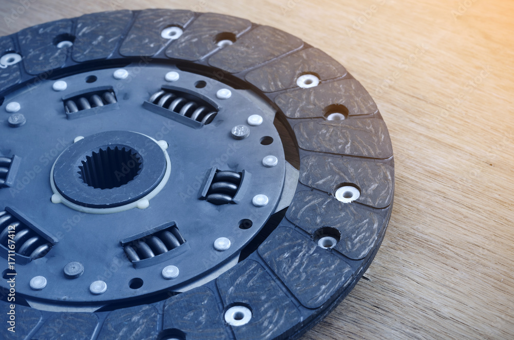 Car clutch plate on  Wood table.