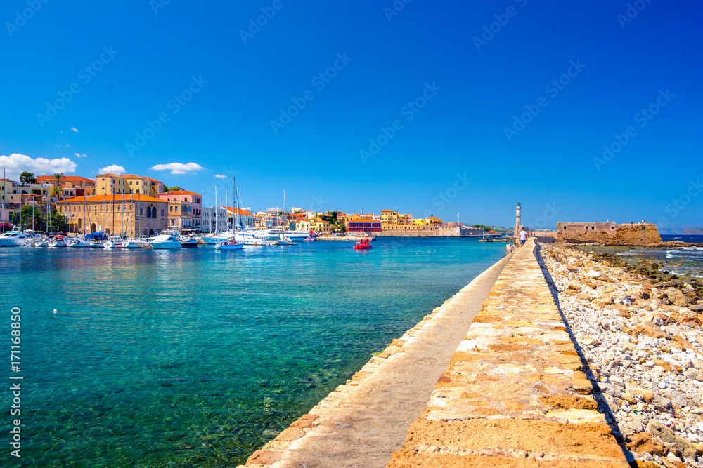 Panorama of the beautiful old harbor of Chania with the amazing lighthouse, Crete, Greece.