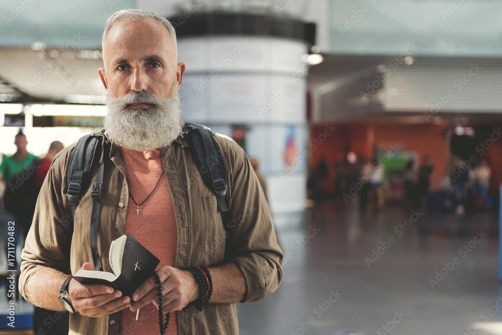 Serene pensioner keeping bible in hand Serene pensioner keeping bible in hand