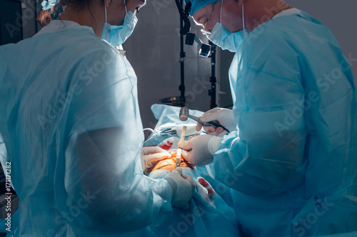 Surgeon uses surgical mallet during the maxillofacial surgery close up photo