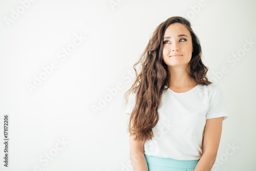 Portrait of a beautiful young woman thinking photo