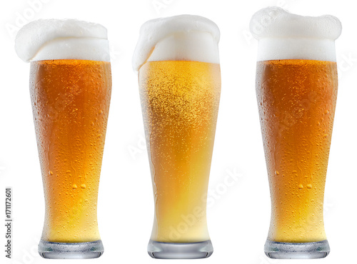 Mug of frosty light beer with foam isolated on a white background