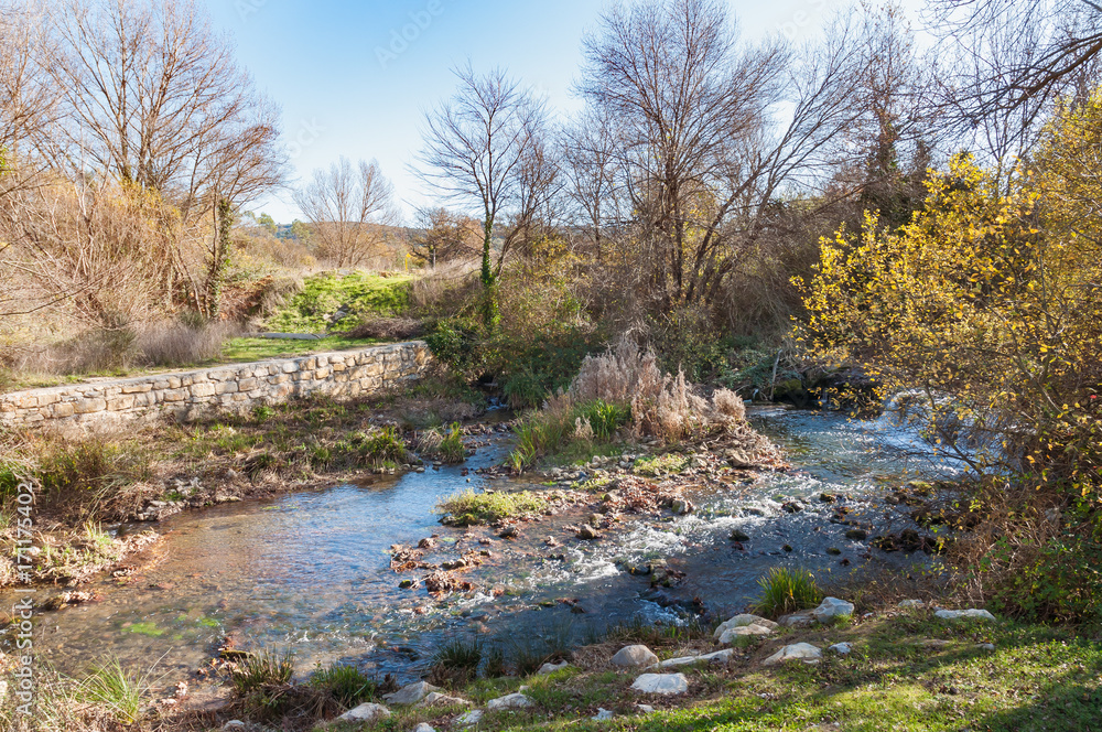 The Issole is a little stream in Provence, South of France. Here, near Garéoult, viewed at sunset The Issole is a little stream in Provence, South of France. Here, near Garéoult, viewed at sunset