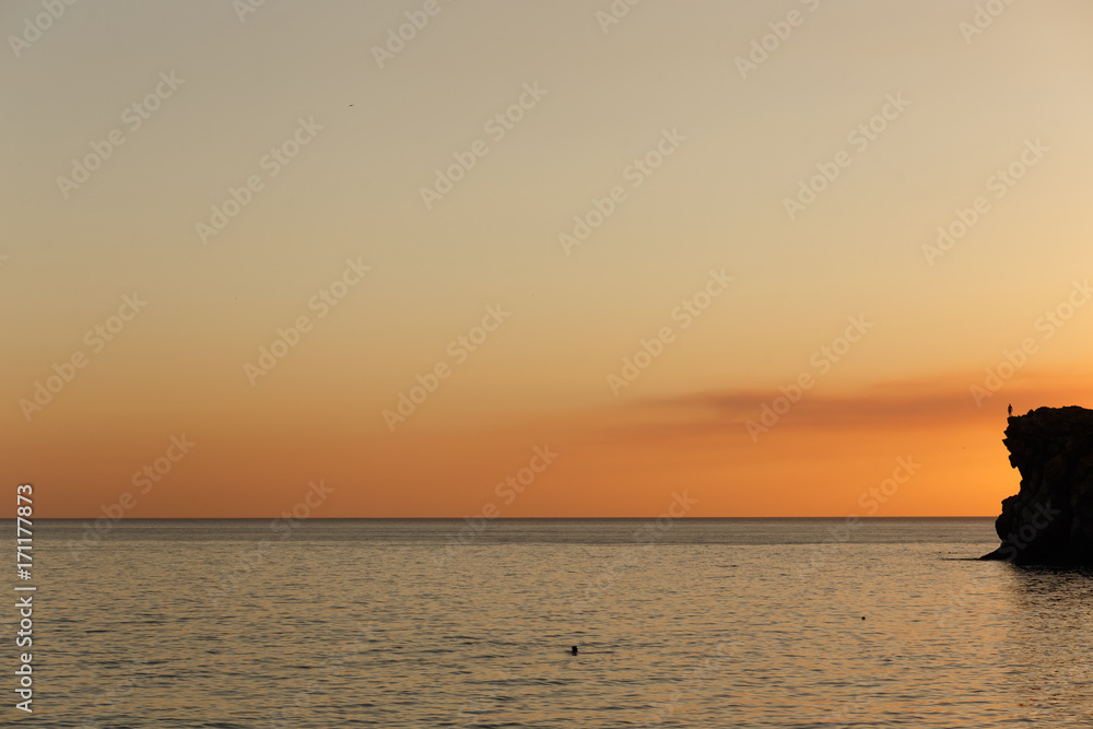 Sunset and the sea. Incredible sky. Whimsical clouds. Patterns in the sky. Evening landscape. Background with water. Seascape. Without people. No one. Calm in the 