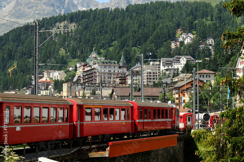 Billede på lærred Red Train Bernina Express Arrive at St. Moritz, Switzerland.