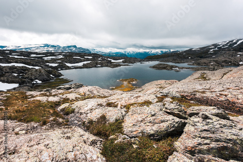 Typical norwegian landscape with snowy mountains