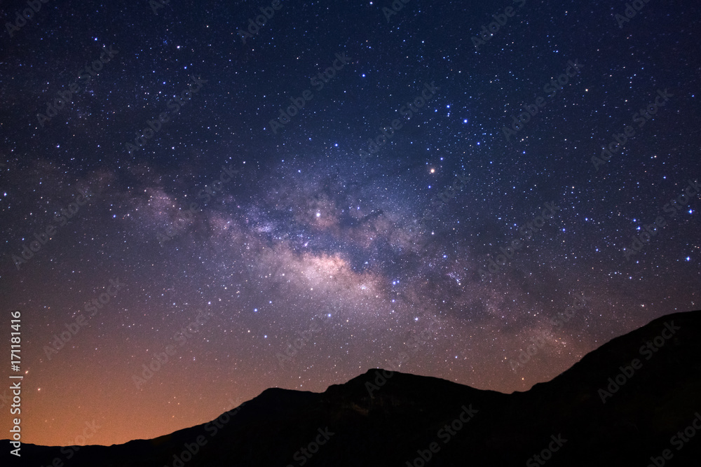 Beautiful milky way galaxy over moutain on a night sky before sunrise.