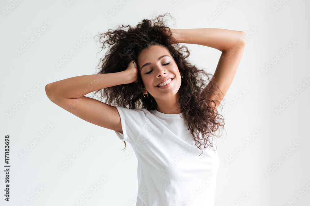 Fototapeta premium Smiling attractive girl with eyes closed