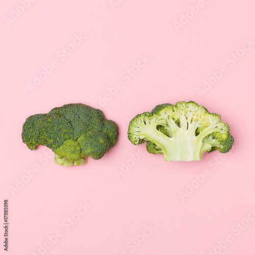 Top view of broccoli on a pastel pink background. Seasonal vegetable. Minimal concept. Vegan food.  The concept of a healthy diet