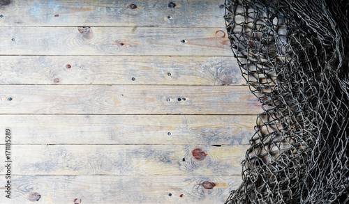 Fishing nets on wooden background. Still-life and objects. photo