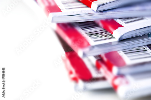 Close up the part of barcode on red magazine stacking with white background , background for copyright article concept photo