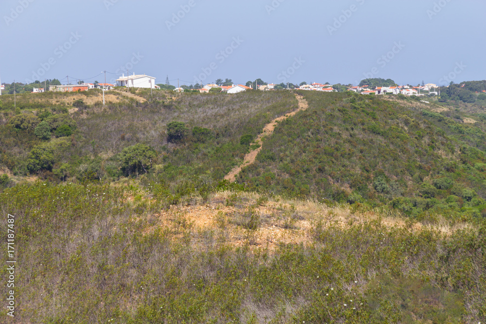 Building and trail in mountain, Aljezur village Building and trail in mountain, Aljezur village