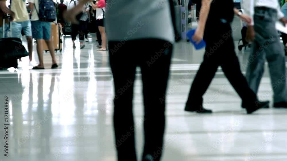 Crowd of traveller arriving at the busy airport for check-in and boarding aeroplane Crowd of traveller arriving at the busy airport for check-in and boarding aeroplane