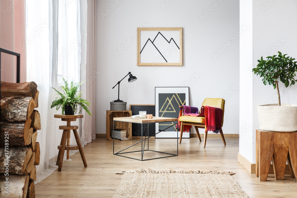 Armchair, minimalist poster and firewood Armchair, minimalist poster and firewood