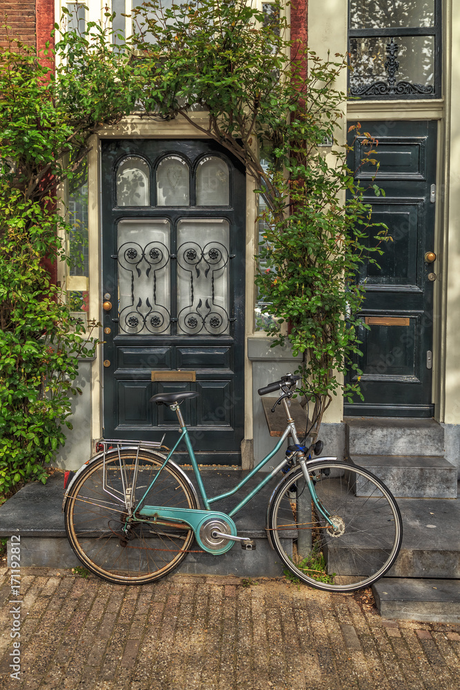 Bicycle in front of a House.