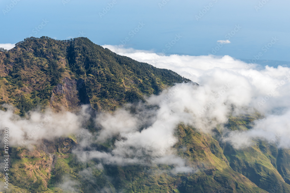 Mountain with Low altitude clouds above. Rinjani mountain, Lombok, Indonesia.