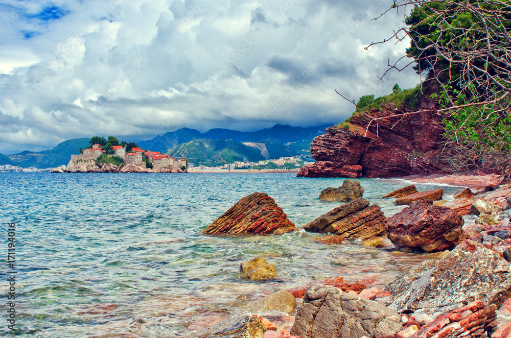 View from wild beach Crvena Glavica for Sveti Stefan island. Montenegro, Adriatic sea.