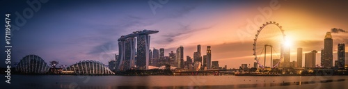Panorama image of Singapore Skyline and view of skyscrapers on Marina Bay view from the garden by the bay at sunset.