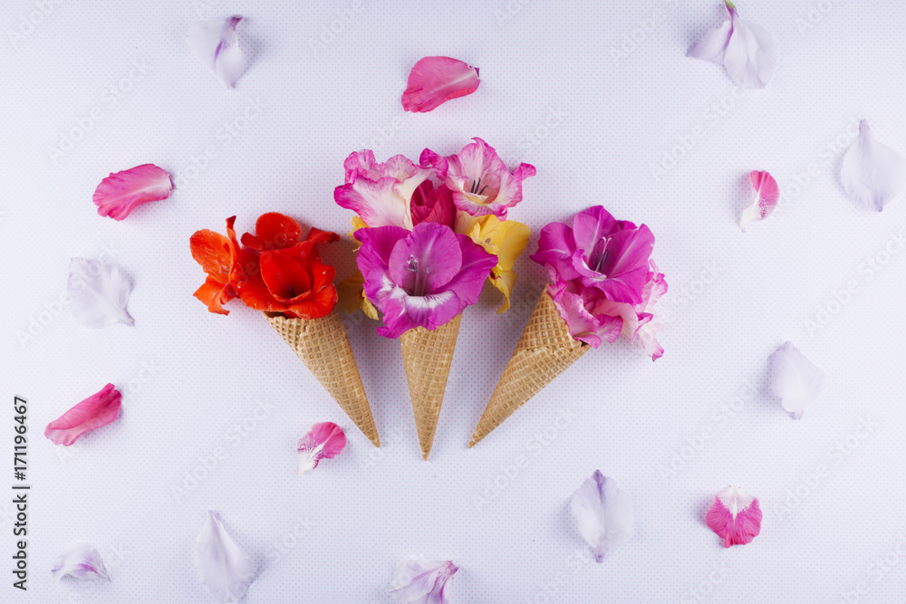 Waffle cone with composition of flowers.