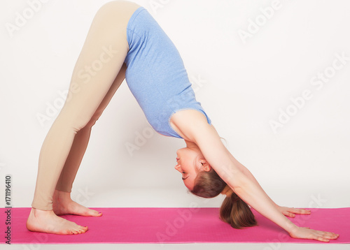 Portrait of attractive woman doing yoga, pilates. Healthy lifestyle and sports concept. 