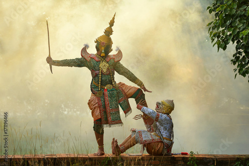 Two masked dancers performing Thai Khon pantomime, Thailand photo