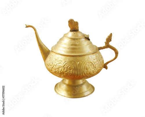 Antique brass teapot with a pattern isolated on white background