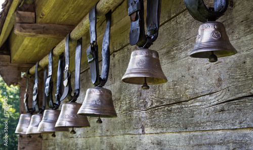 Quadro su tela Cow Bells outside of Farmhouse in Switzerland