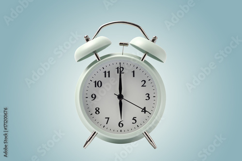 pastel retro alarm clock or vintage alarm clock isolated with clipping path