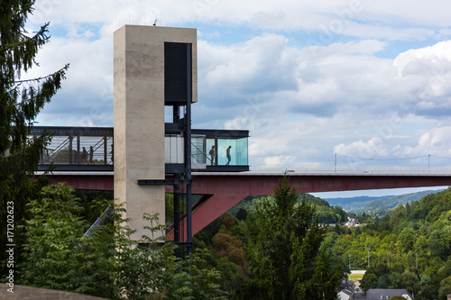 View on a Lift with a red bridge in the background in Luxembourg City