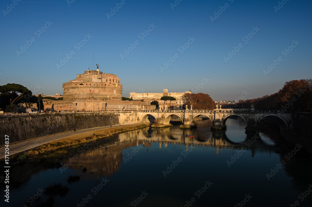 Castel Sant Angelo in Italy Rome at sunset Tiber River with reflection