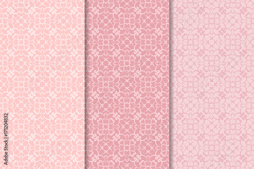 Set of floral ornaments. Pale pink vertical seamless patterns