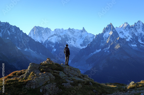 Man looking at the mountains near Chamonix, France. © sanderstock