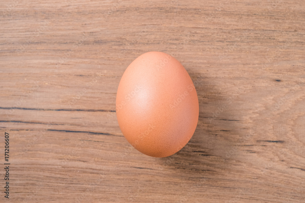 Close up Single Egg on wooden background, isolated, fresh egg