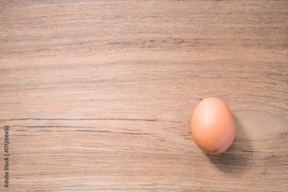 Close up Single Egg on wooden background, isolated, fresh egg