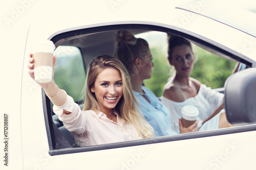 Young women traveling by car with map © Kalim