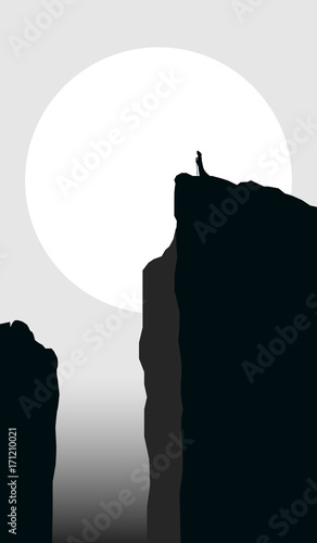mysterious landscape with cloaked man silhouette on cliff