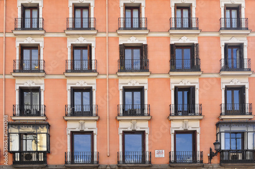 Frontal view of a building painted in orange