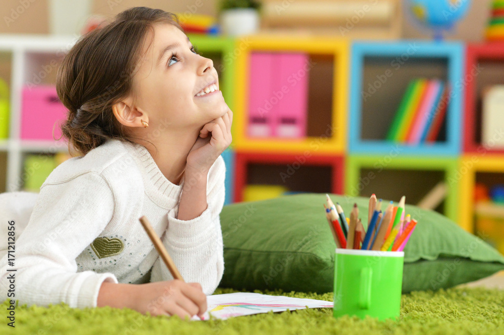 girl drawing at home