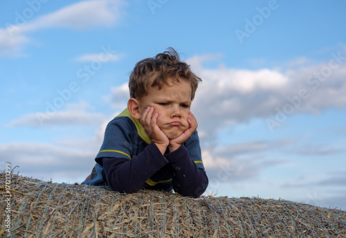 European boy with an emotion of resentment