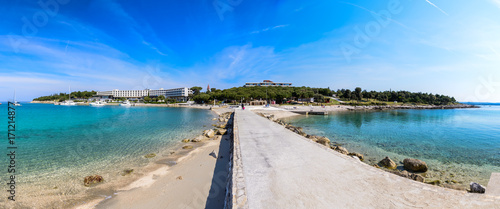 Seaside hotel with beach and turquoise water, Sveti Andrija or Red island near Rovinj, Croatia