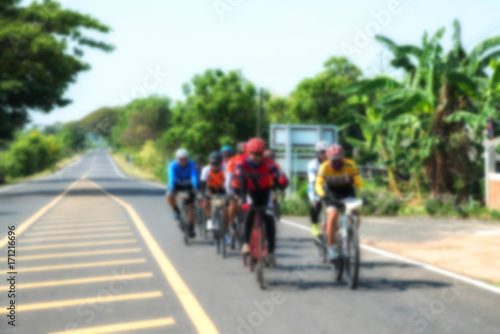 Blur active road bicycle racer on outdoor training