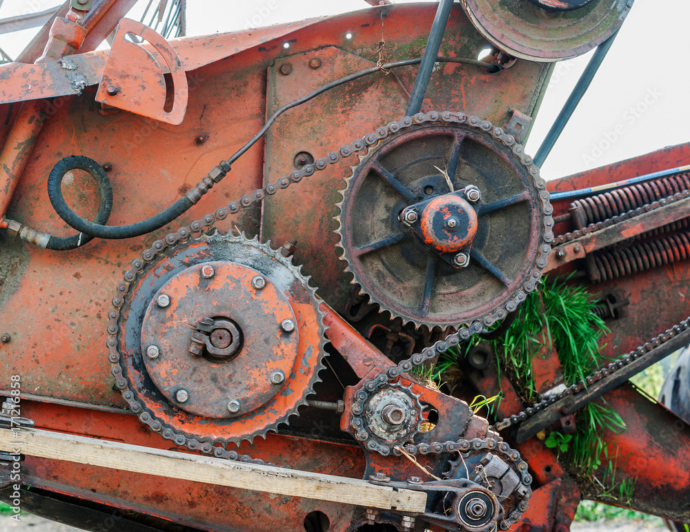 Gears and gear chains. Mechanisms of an old combine harvester. Old technics. Gears and gear chains. Mechanisms of an old combine harvester. Old technics.