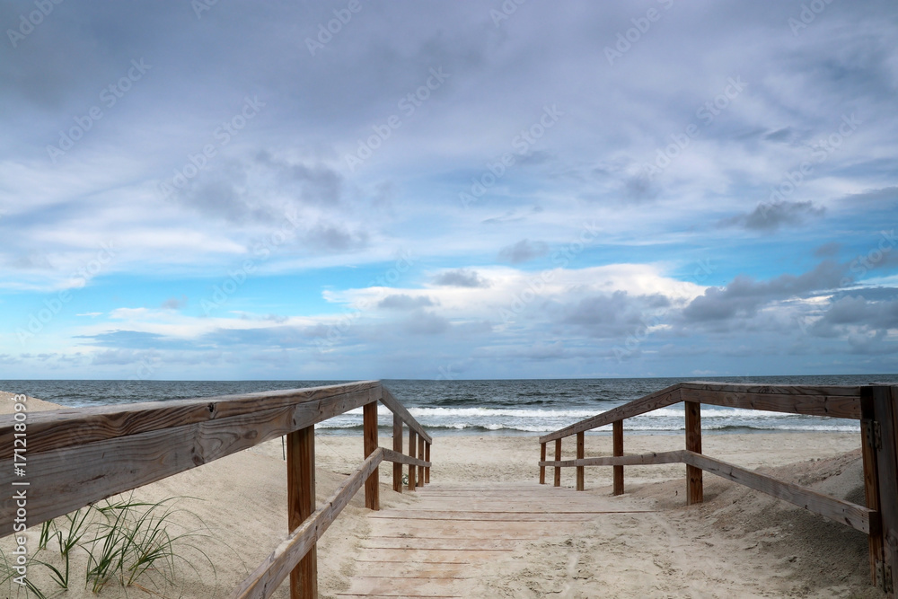 Way to the beach. Marine landscape with wooden boardwalk leads to the atlantic ocean beach. Pawleys Island, Myrtle Beach area, South Carolina USA.