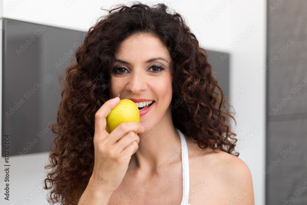 Beautiful woman eating an apple Beautiful woman eating an apple