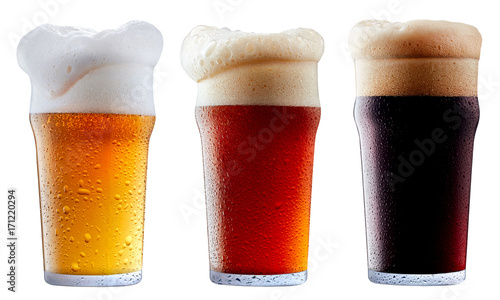 Mug collection of frosty dark red and light beer with foam isolated on a white background