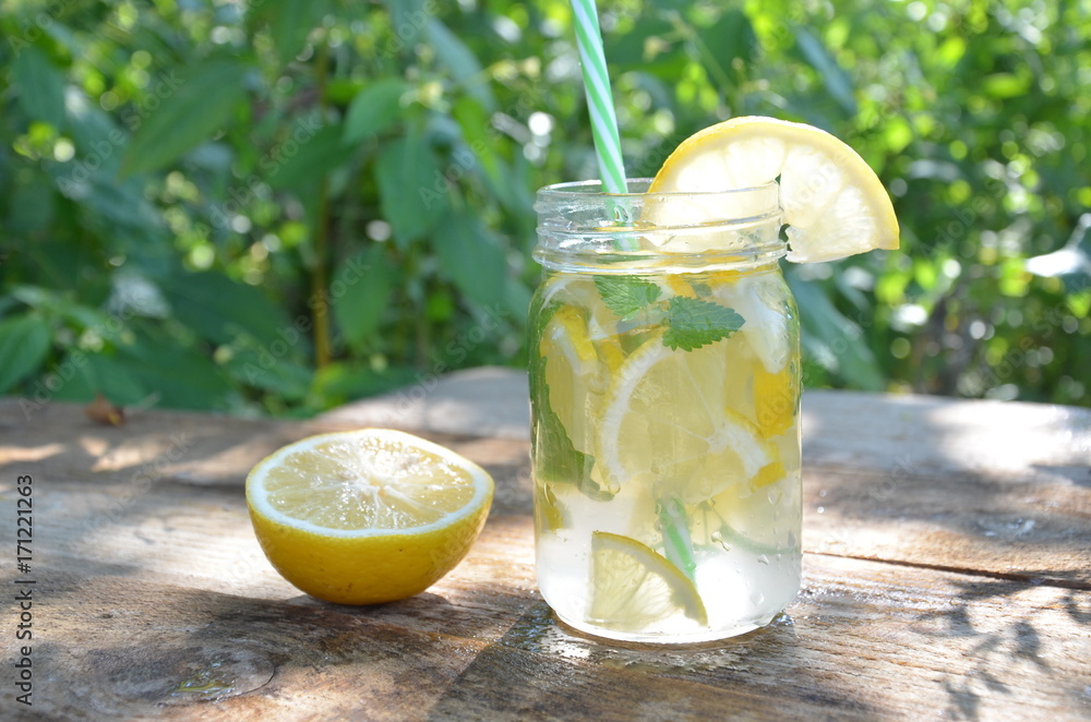 Lemon mojito cocktail with mint lemonade, cold refreshing drink or beverage, ice Lemon mojito cocktail with mint lemonade, cold refreshing drink or beverage, ice