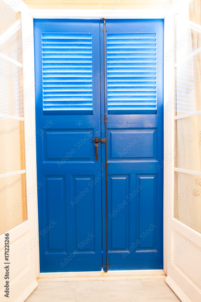 Blue door and window with shutters Blue door and window with shutters