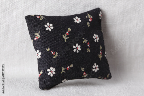 Black cushion with flowers