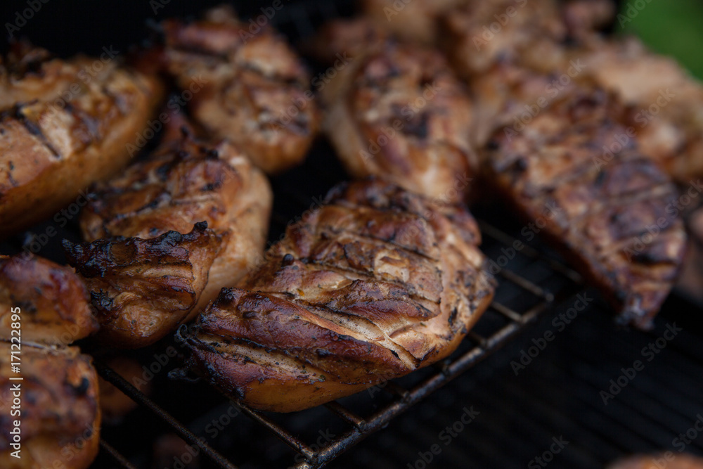 Grilled chicken breast on the grill